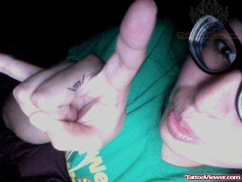 M Tattoo On Finger