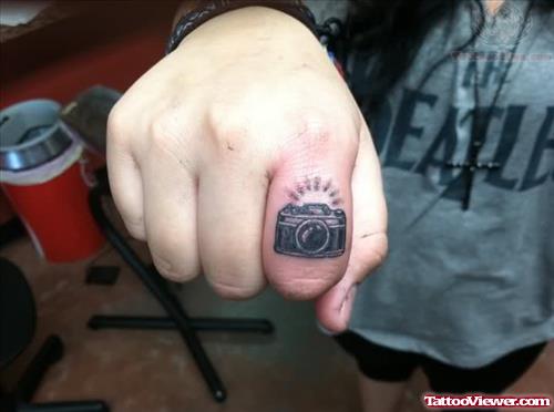 Tiny Camera Tattoo On Finger