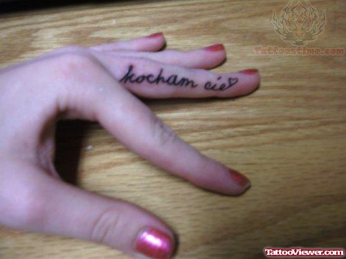 Kocham Cie Tattoo On Finger