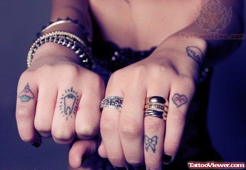 Bow And Heart Tattoo On Fingers