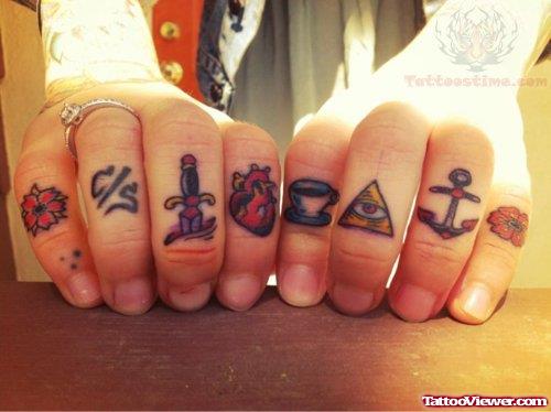 Heart And Dagger Tattoo on Fingers