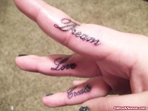 Dream And Love Tattoo On Fingers