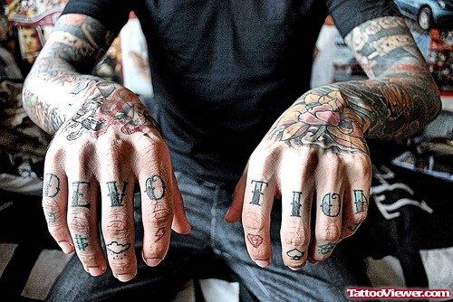 Devotion Tattoo On Fingers