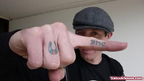 Horse Shoe And BMC Tattoo On Fingers