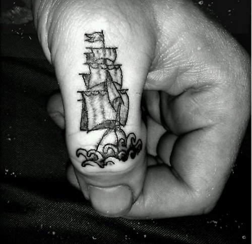 Grey Ink Ship Finger Tattoo