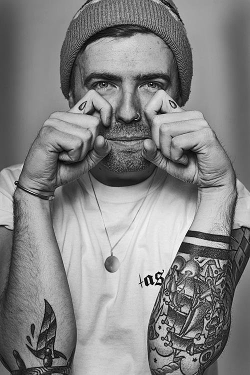 Man With Tear Drops Finger Tattoos