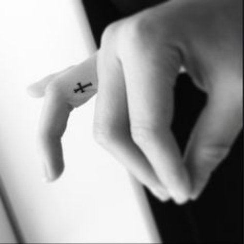 Tiny Cross Finger Tattoo