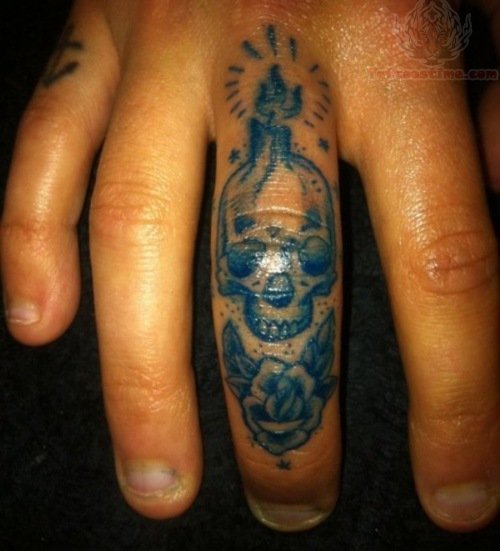 Skull Head Candle Tattoo On Finger