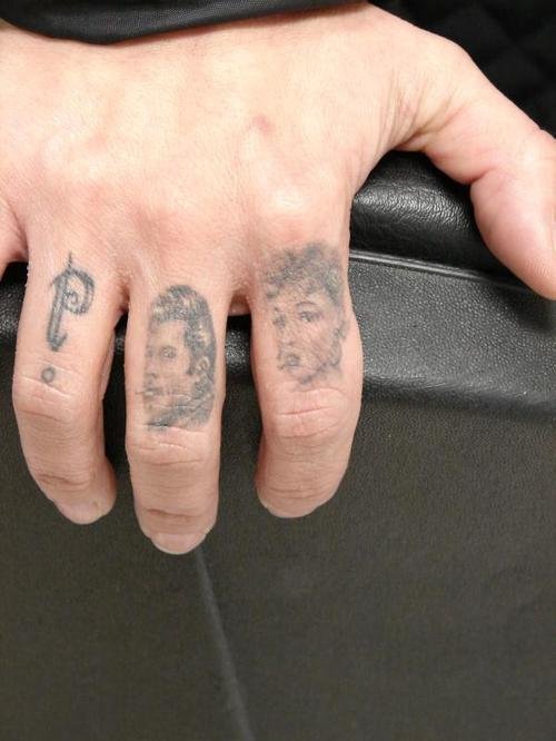 Grey Ink Portraits Finger Tattoos