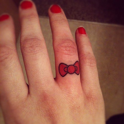 Red Ink Finger Tattoos For Girls