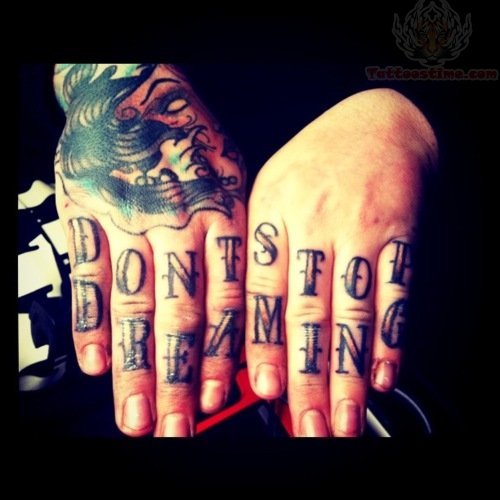 Dont Stop Dreaming Tattoo on Fingers