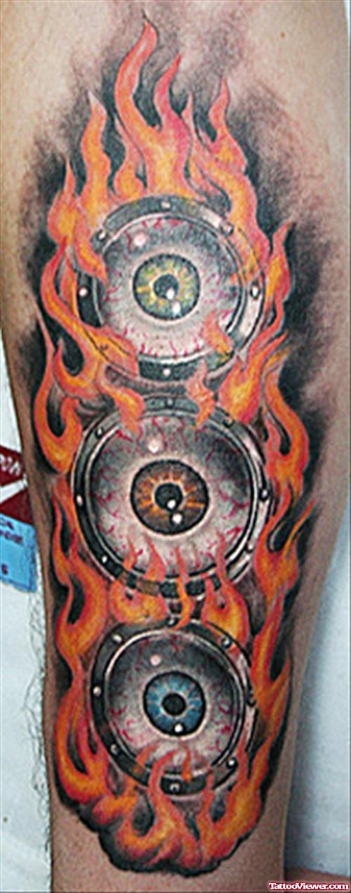 Eyeballs On Flame Tattoo On Arm