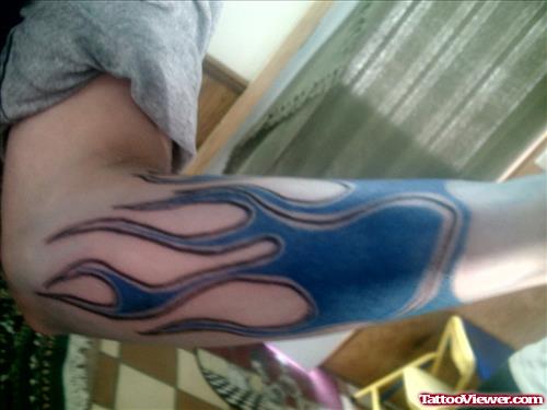 Blue Ink Fire n Flame Tattoo On Arm