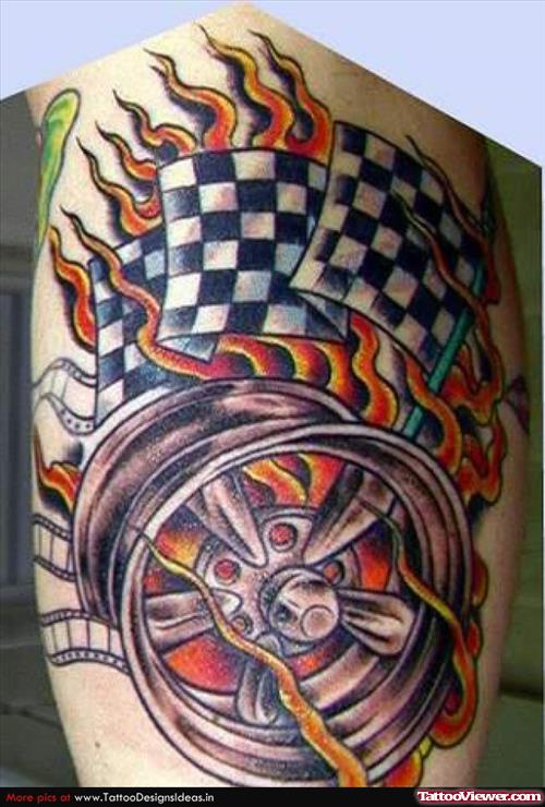 Rally Flags And Flaming Wheel Tattoo On Leg