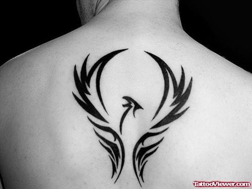 Tribal Phoenix Fire And Flame Tattoo On Upperback