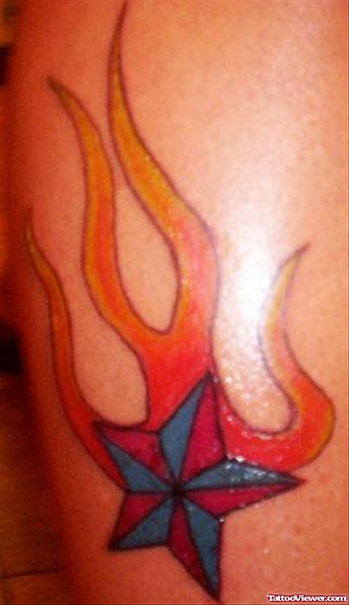 Colored Nautical Star With Fire Flame Tattoo