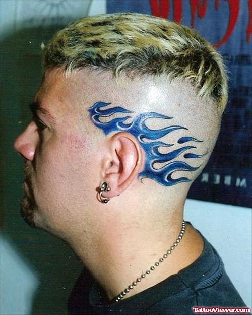 Blue Ink Fire n Flame Tattoo On Head