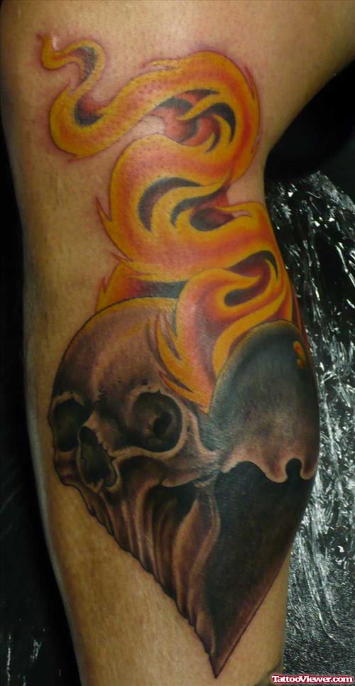 Grey Ink Skull Heart With Flames Tattoo On Leg