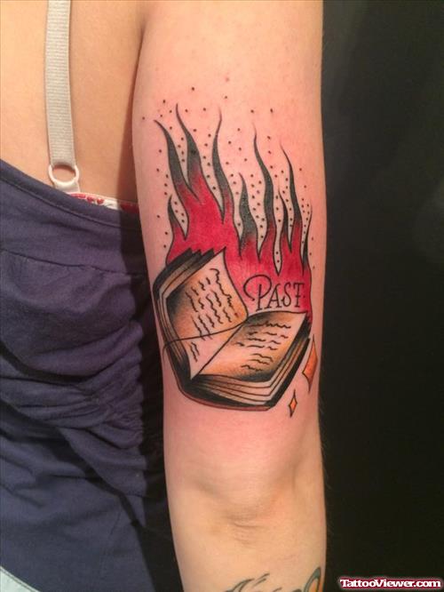 fire flame book tattoo on elbow