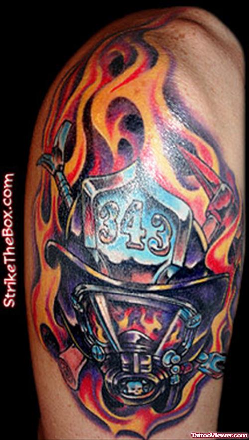 Flaming Firefighter Mask Tattoo On Shoulder