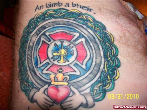 Claddagh And Firefighter Tattoo On Shoulder