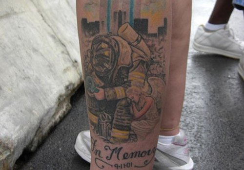 Firefighter Tattoo On Left Leg