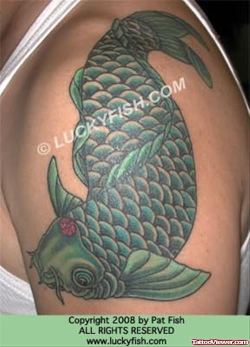 Green Fish Tattoo On Shoulder