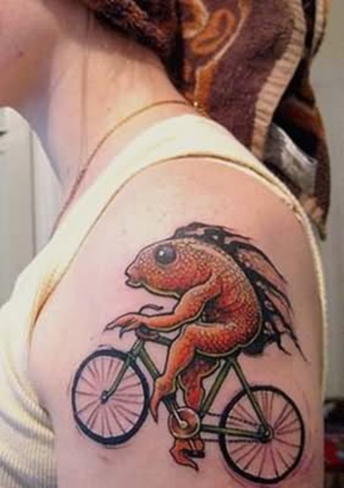 Fish On Cycle Tattoo On Shoulder