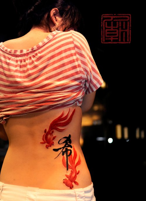 Kanji Symbol and Fish Tattoo On Back
