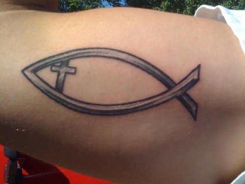 Grey Ink Cross And Jesus Fish Tattoo On Biceps
