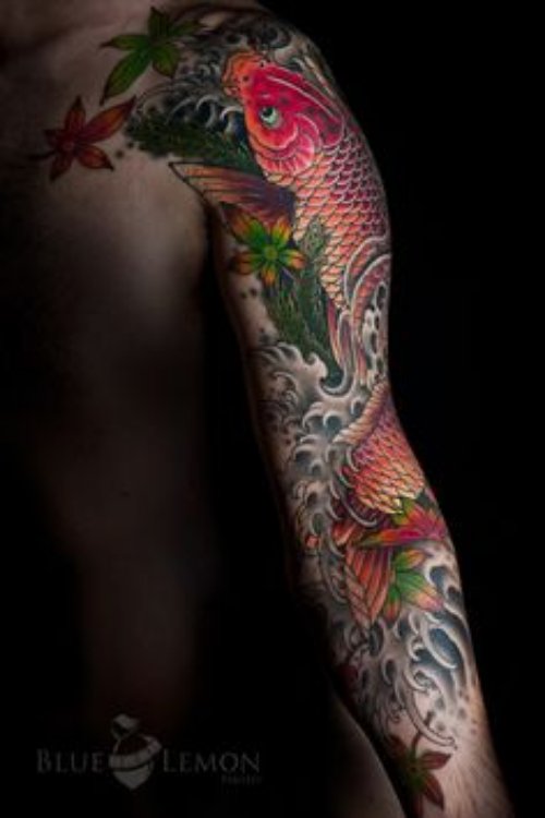 Amazing Colored Fish Tattoo On Sleeve