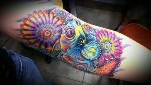 Amazing Colored Flowers And Fish Tattoo On Half Sleeve