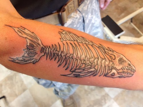Fish Skeleton Tattoo On Right Sleeve