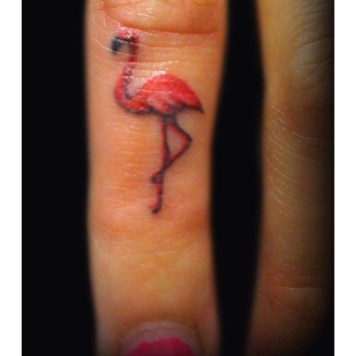 Red Ink Flamingo Tattoo On Finger