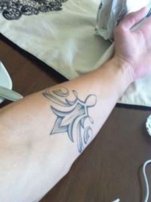 Fleur De Lis Arm Tattoo