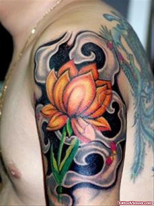 Colored Lotus Flower Tattoo On Left Shoulder