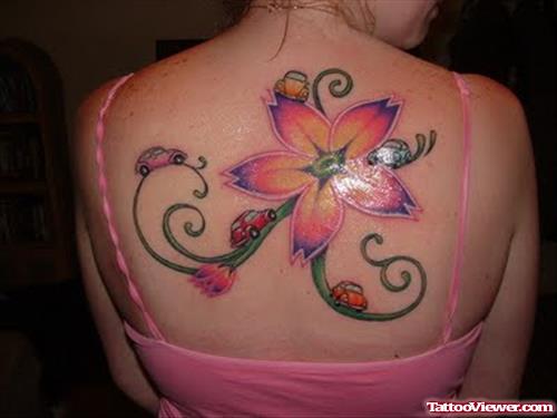 Tribal And Pink Lotus Flower Tattoo On Upperback