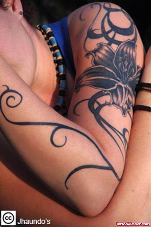 Tribal And Vine Flower Tattoo On Left Sleeve