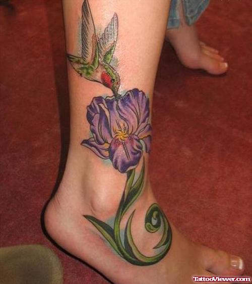 Flying Hummingbird And Purple Flower Tattoo On Ankle