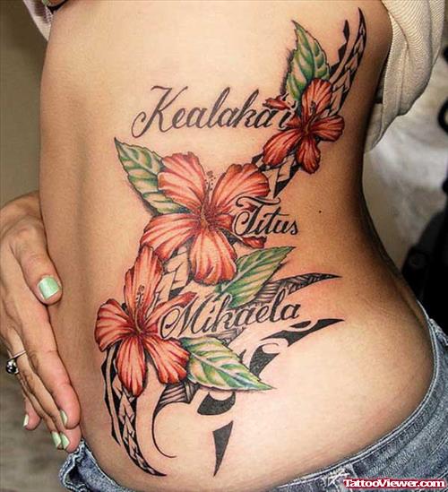 Polynesian and Flower Tattoos On Side Rib