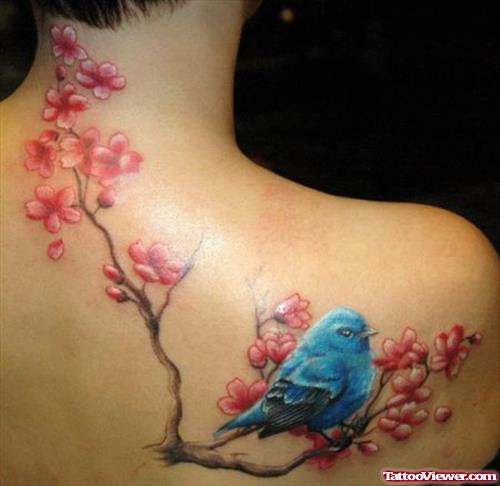 Blue Bird And Flower Tattoos On Upperback