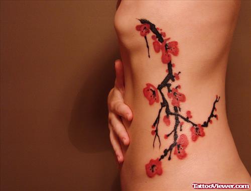 Red Flowers Tattoos On Rib