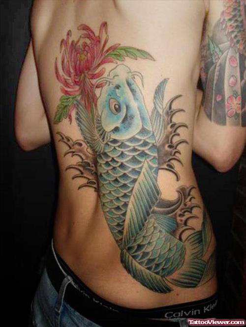 Blue Ink Koi And Flower Tattoo On Back