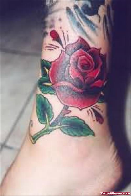Girl Showing Red Rose Flower Tattoo