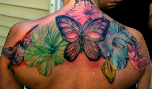 Colored Butterflies And Hibiscus Flower Tattoos On Upperback