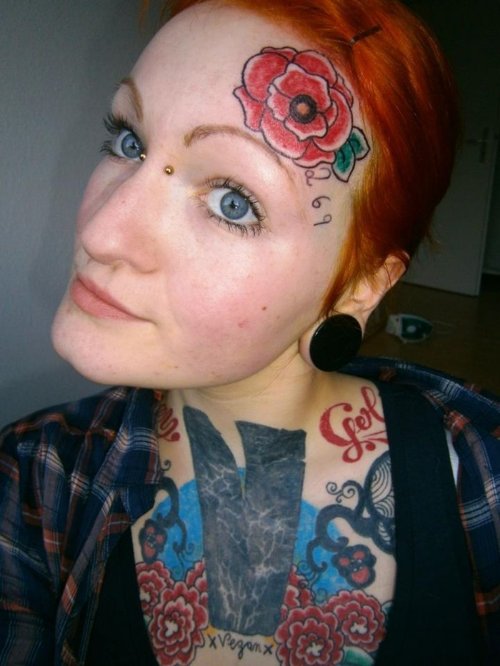 Red Flower Tattoo On Forehead