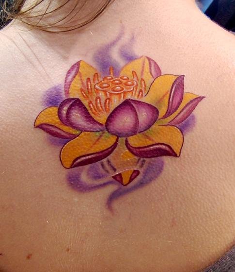 Awesome Colored Lotus Flower Tattoo On Upperback