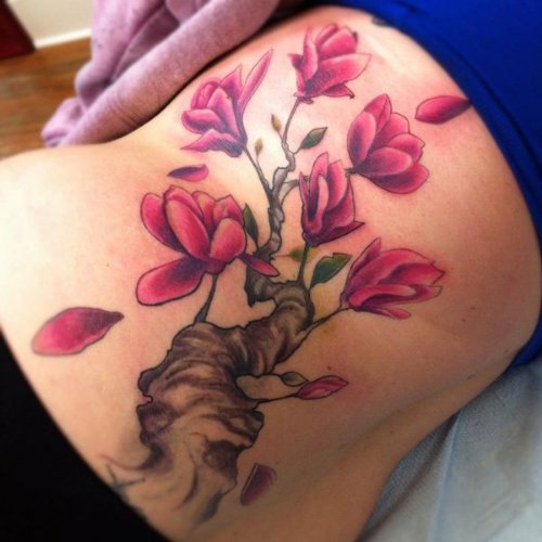 Pink Flowers Tattoo On Girl Lower Back