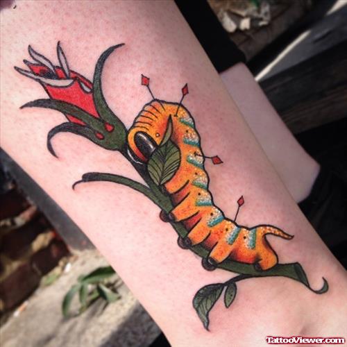 caterpillar on flower tattoo