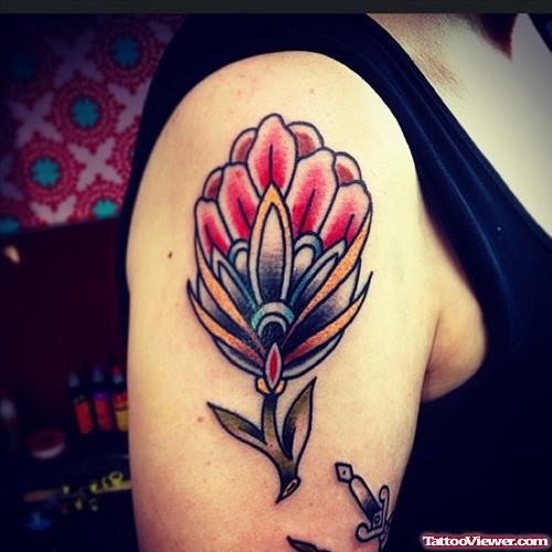   flower with petals tattoo on shoulder